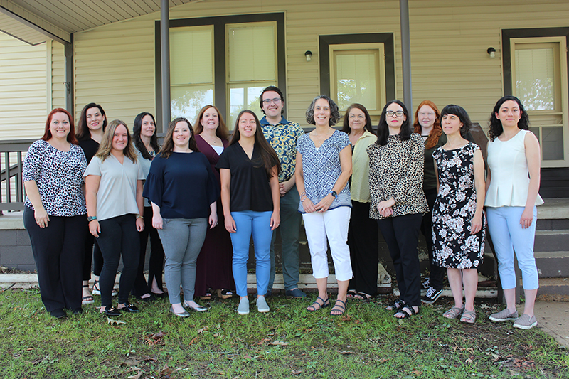 NRTC staff in front of new house.